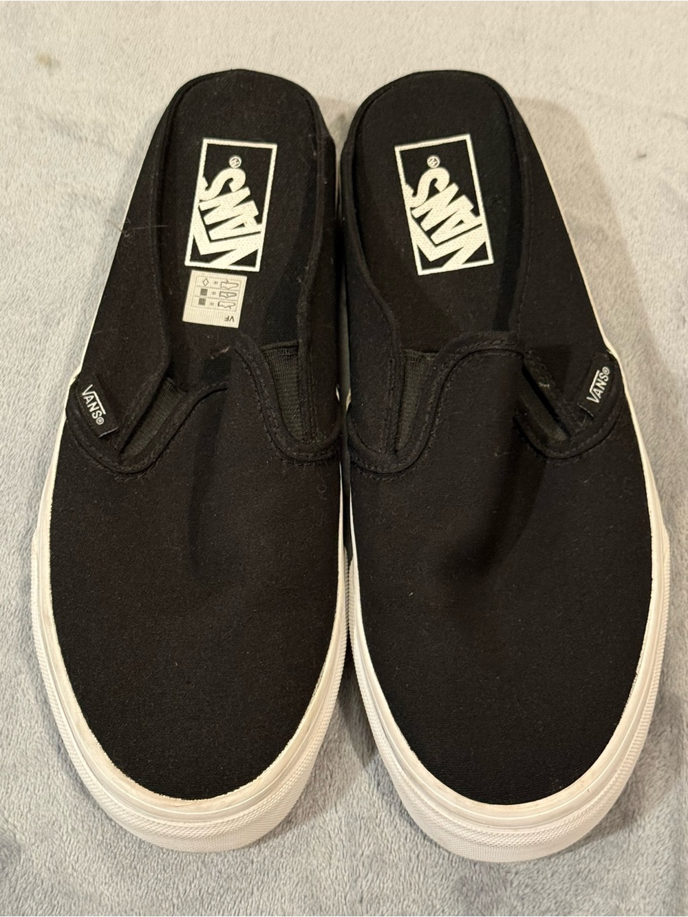 Vans slip on shoes in black. NWOT